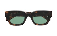 a pair of tortoise sunglasses with green lenses